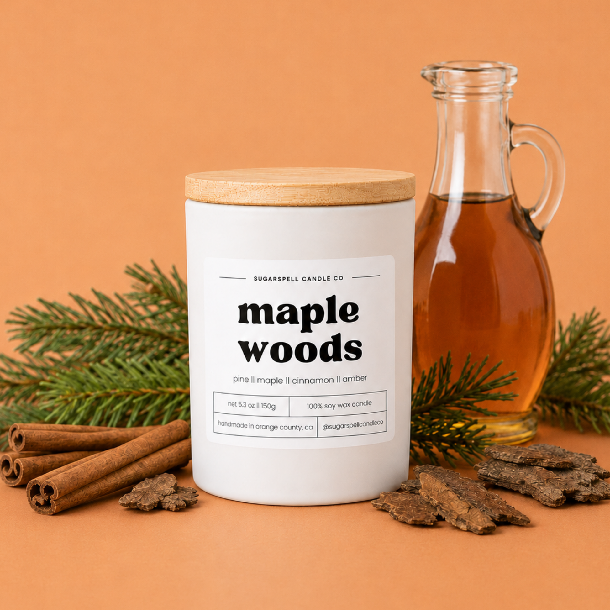 Handmade Maple Woods soy candle in a white glass jar with pine and cinnamon