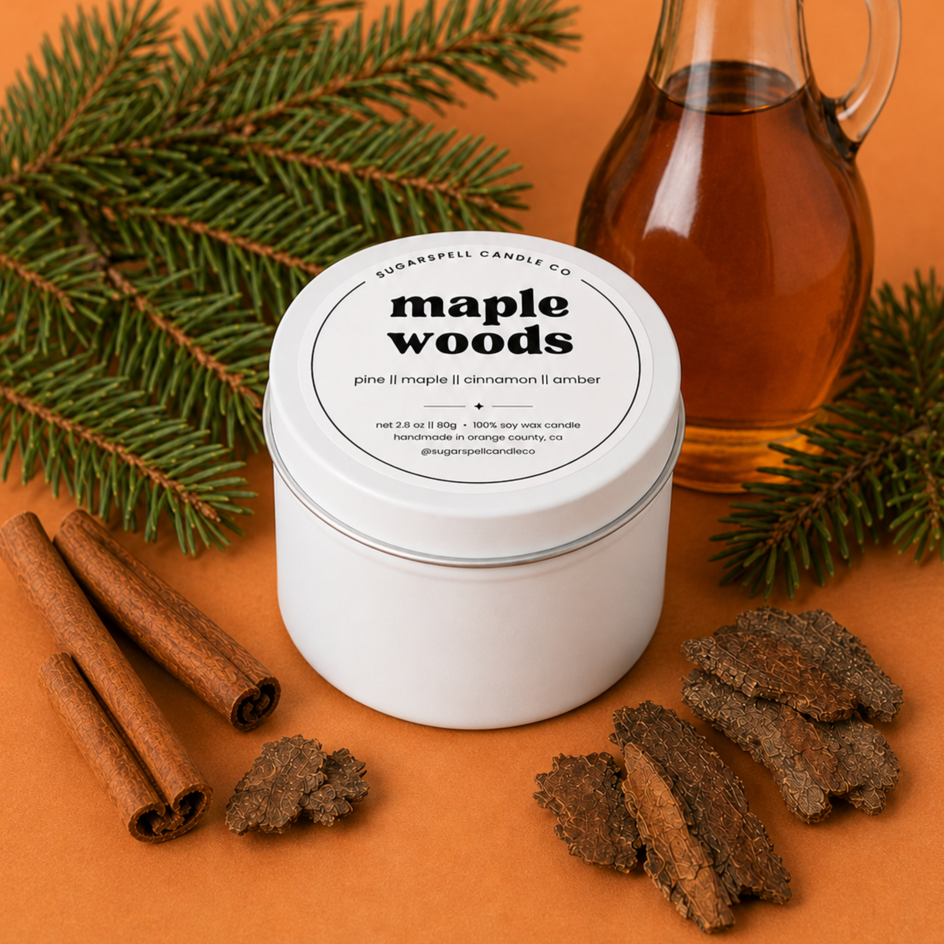 Handmade Maple Woods mini candle tin styled with maple syrup, cinnamon and evergreen