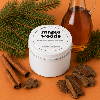 Handmade Maple Woods mini candle tin styled with maple syrup, cinnamon and evergreen